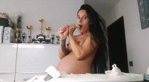 Horny and pregnant Lexi Dona undressing in the kitchen to sate her appetite