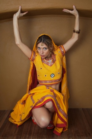 Indian amateur works free of traditional clothing for a nude shoot