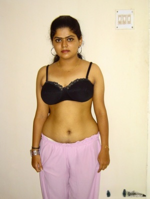 Indian girl Neha sets her natural boobs free of a black brassiere