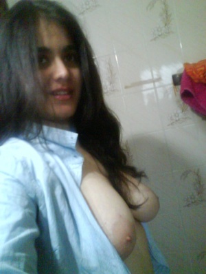Indian girl takes self shots with big natural tits free of blouse