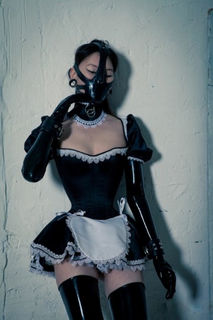 Korean model poses for a solo shoot in a naughty rubber maid outfit