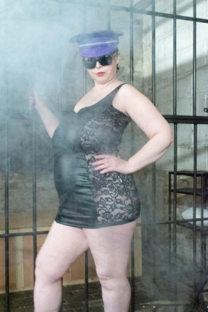 British fatty Posh Sophia models fetish wear in and out of a jail cell