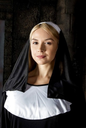 Blonde babe Sara Sloane strips off nuns uniform to expose big tits