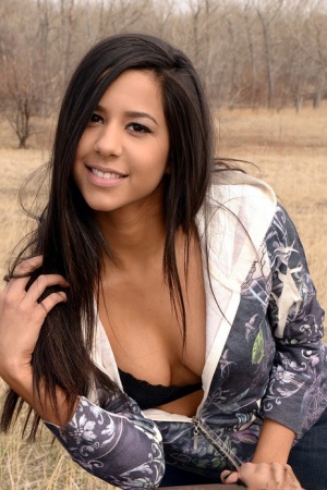 Amateur model Bella Quinn exposes black bra on an outdoor bench 68550300