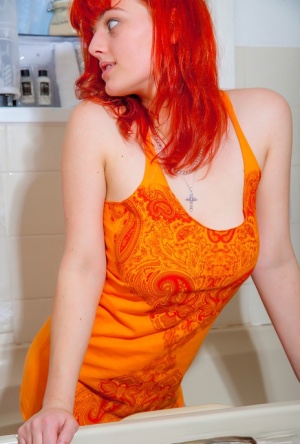 Redhead amateur Charlotte covers her large tits with soap bubbles in a tub 57234583