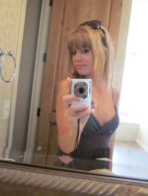 Cute young girl Diddylicious takes selfies while going topless in a bathroom 96039237