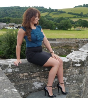 Non nude model Penny poses outside to show off her super hot legs and ankles