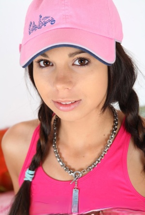 Cute teen Kiki 18 sports pigtails and a ballcap while having sex on a bed 31515767