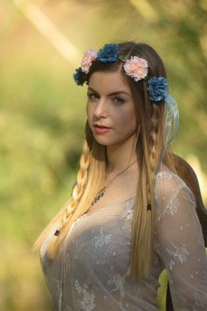 Sweet solo girl takes off her summer dress wearing a crown of flowers 68866469