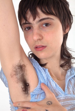 Tattooed girl with furry armpits stretches her really hairy cunt out 13948296