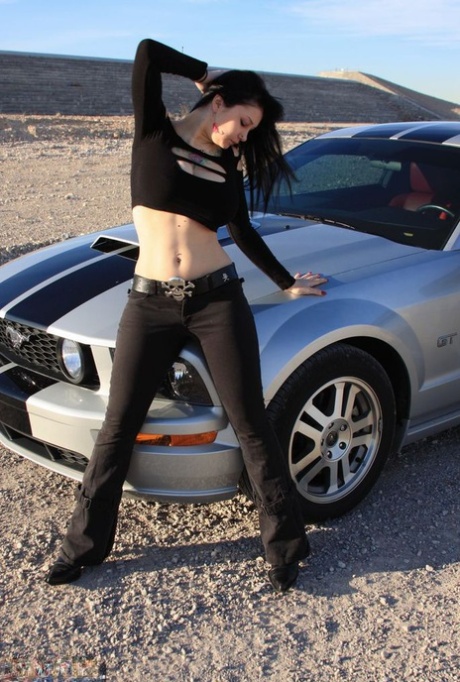 Brunette amateur Susy Rocks models by a muscle car during a safe for work gig 26429908