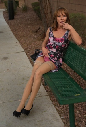Aged lady flashes her tits and twat on a public bench before disrobing at home 45896510