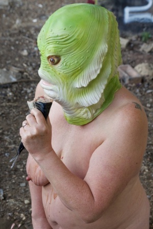 Naked British lady Speedy Bee eats a fish while wearing a costume mask 62075766
