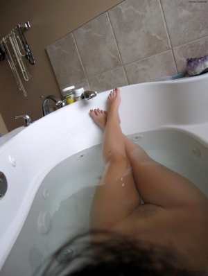 Dark haired amateur shows off her hairy cunt while taking a bath 52477582