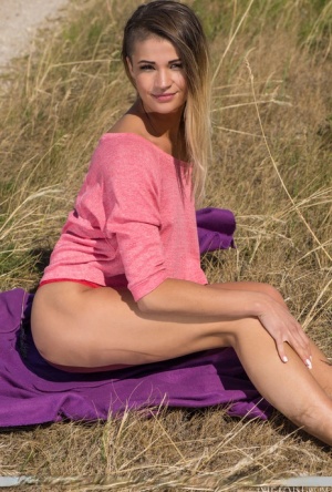 Teen model Kiana shows her tan lined body in a farmer's field 46291932