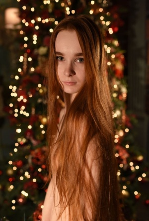 Natural redhead Charlie completely disrobes in front of a Christmas tree 26695890
