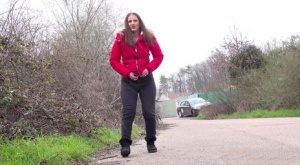 Caucasian teen Nicolette Noir takes a badly needed piss on a paved road