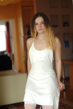 Barely legal beauty Harley gets naked in white stockings by herself