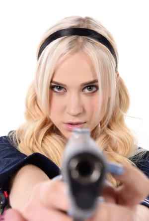 Gorgeous blonde Nikki Hill wields a pistol before disrobing to masturbate