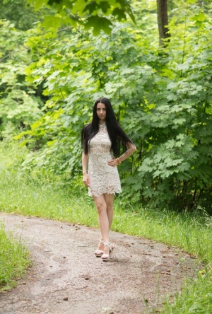 Young girl with long black hair Veronica Snezna goes nude in heels at a park 75265016