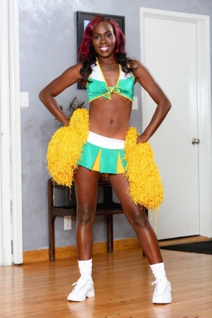 Slim ebony babe Bella Doll loves to preform in a cheerleader outfit