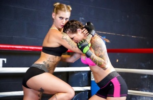 Female kick boxers settle their bout with lesbian sex in boxing ring