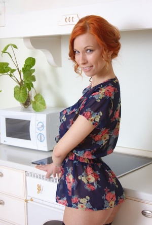 Cute redhead amateur Daisy Lee in naked upskirt spreading her pussy in kitchen 70415494