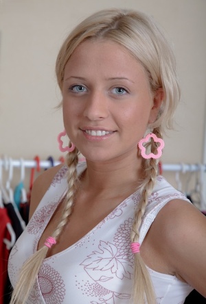 Young blonde Lolita is undressed by her guy before fucking in braided pigtails