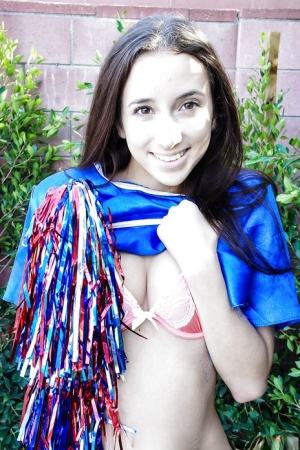 Tiny tits brunette teen Belle Knox is dancing around in a cheerleader form