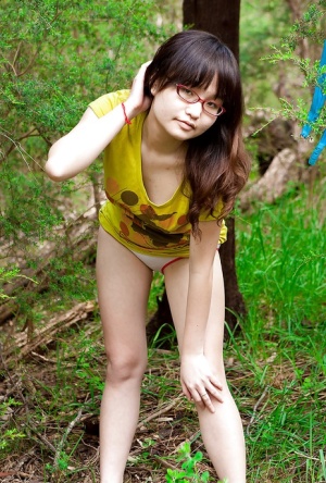 Petite Asian girl in glasses bares hairy vagina outdoors after slow strip 97142742