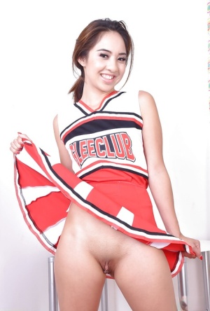Asian amateur Mila Jade exposing smooth pussy underneath cheerleader outfit