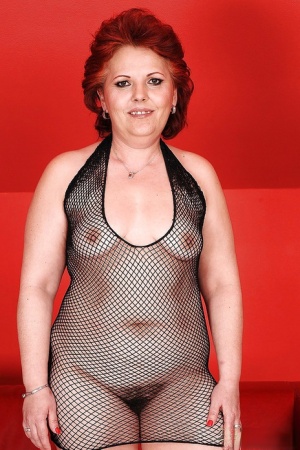 Fatty granny in a fishnet dress spreading her hairy cunt 18299436