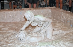 Seductive fully clothed european gals are into messy mud wrestling