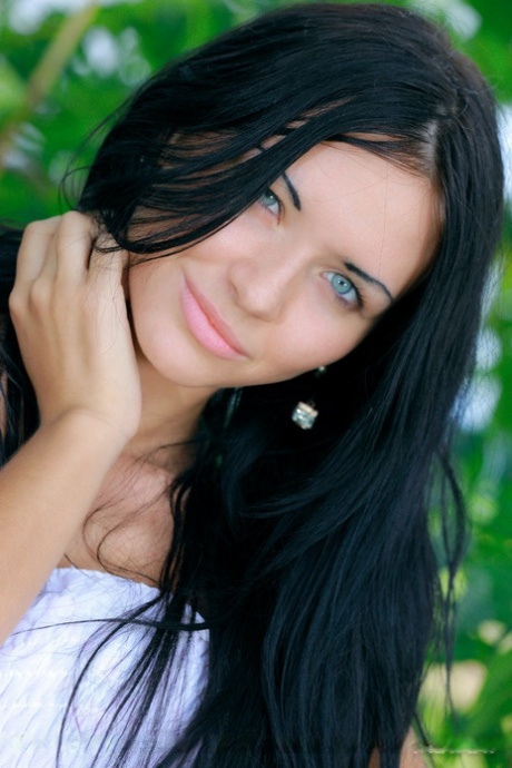 Dark haired Russian teen Kitti A strips totally naked under a tree 97919731