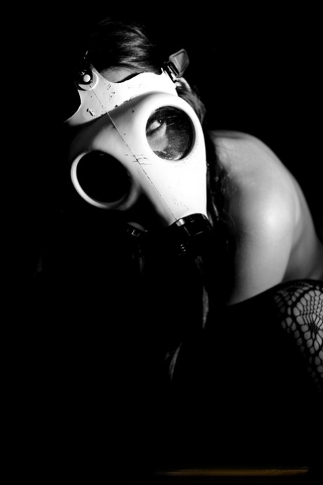 Kinky solo girl Dani Daniels flashes her tits while wearing a gas mask 45805851