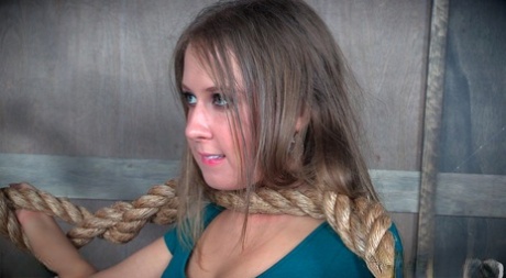 Petite blonde Brooke Bliss is restrained with a rope during BDSM play 98508824