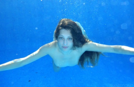 Bashful young sunbather Talia Mint doffs bikini to finger poolside & swim nude 38106120