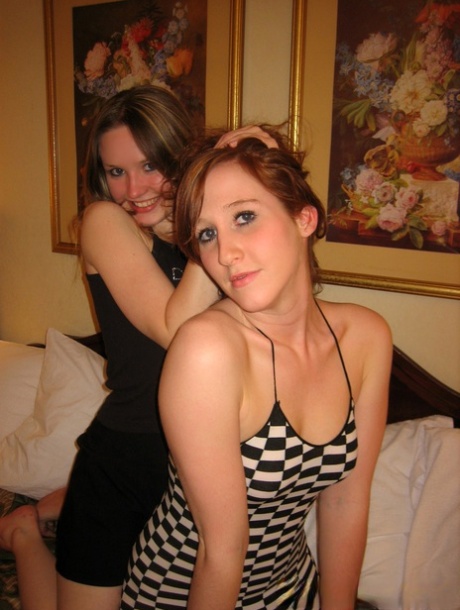 Teen lesbians Anna & Kitty removing their clothing during foreplay on a bed 27615740
