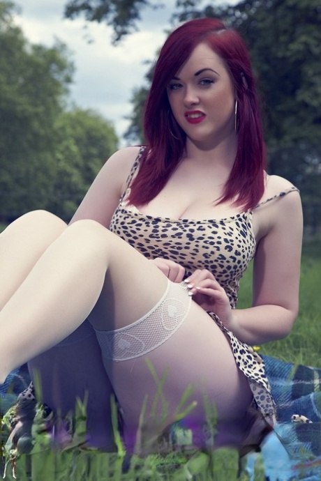 Redhead plumper Jaye Rose strips to her whites stockings atop blanket on grass 91822499