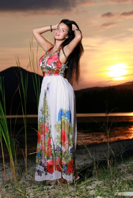 Dark-haired teen Lola Marron slips out of a long dress to pose nude at sunset 27825162