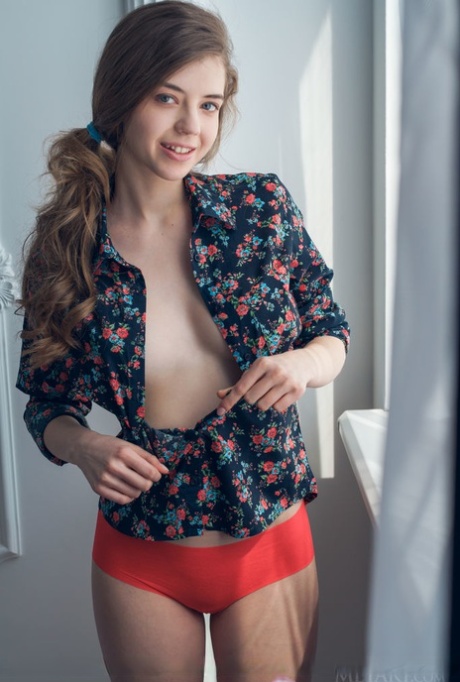 European teen Kay J peels off red panties and socks for nude posing 43353938