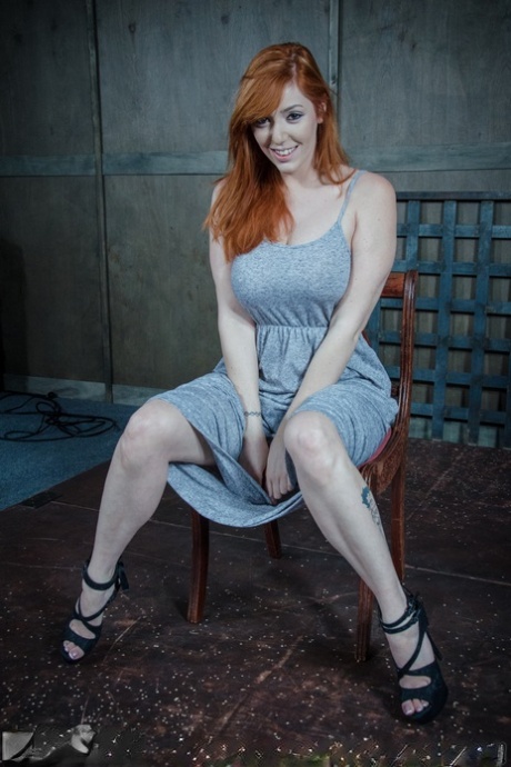 Big boobed redhead Lauren Phillips finds herself restrained in a dungeon 30326297