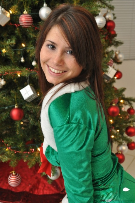 Amateur Xmas elf Hailey lifts her tight skirt to show her sexy ass by the tree 84700181