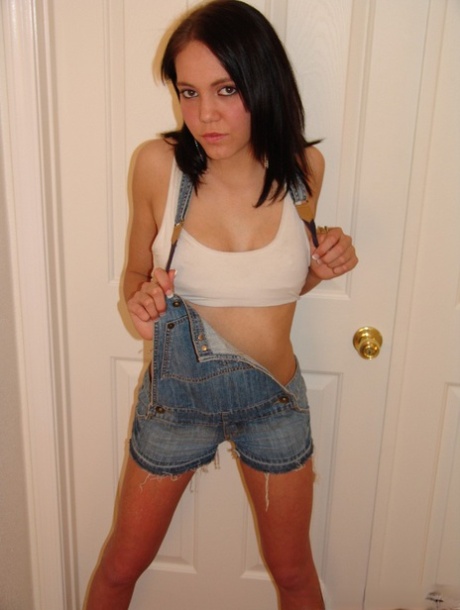 Young brunette Jamie works free of cut off denim overalls to get naked 60064773