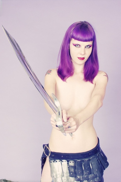 Goth girl Szandora wields a blade while going topless in a skirt 89688004