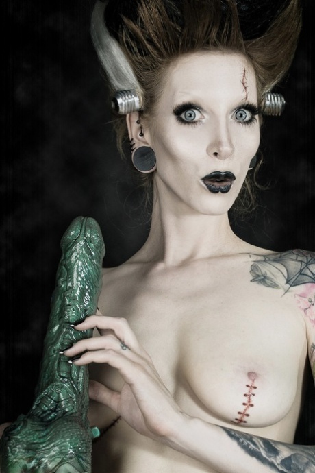 Tattoo model Razor Candi sucks on a big dildo in Bride of Frankenstein attire 29860724