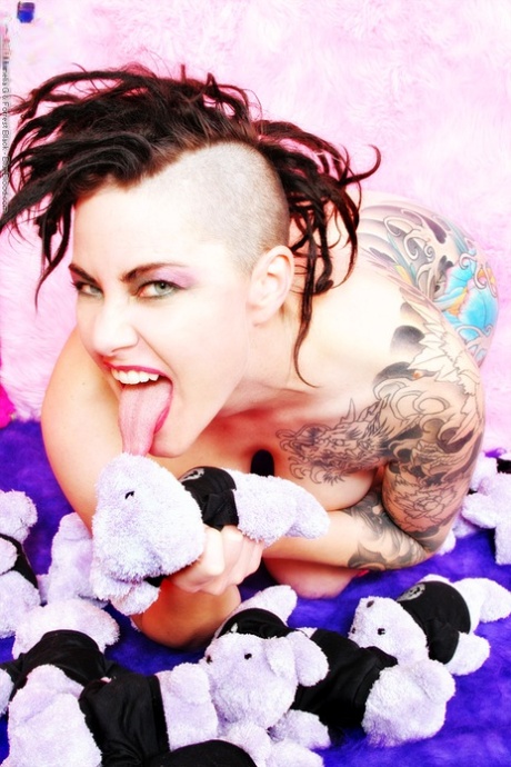 Tattooed chick Michelle Aston covers up her naked body with stuffed animals 42902776