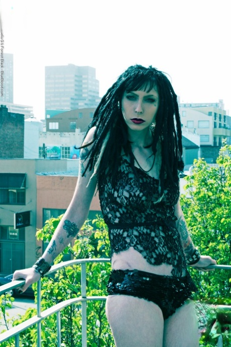 Tattooed goth Stephanie Slaughter gets naked on a balcony in the city 89949997