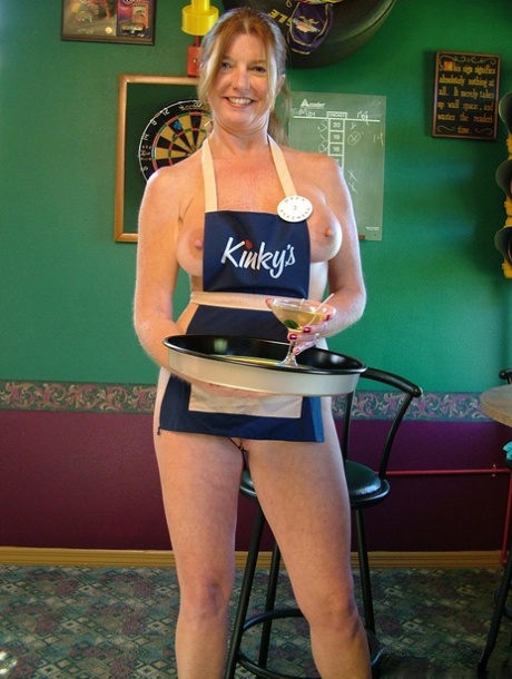 Mature lady Dee Delmar goes topless while waiting tables in a pub 85075721