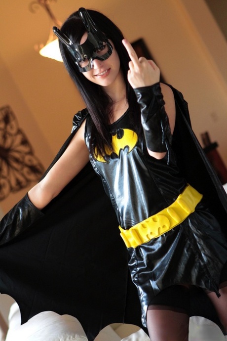 Dark haired chick Catie Minx takes off a Batman suit to model in the nude 23197205
